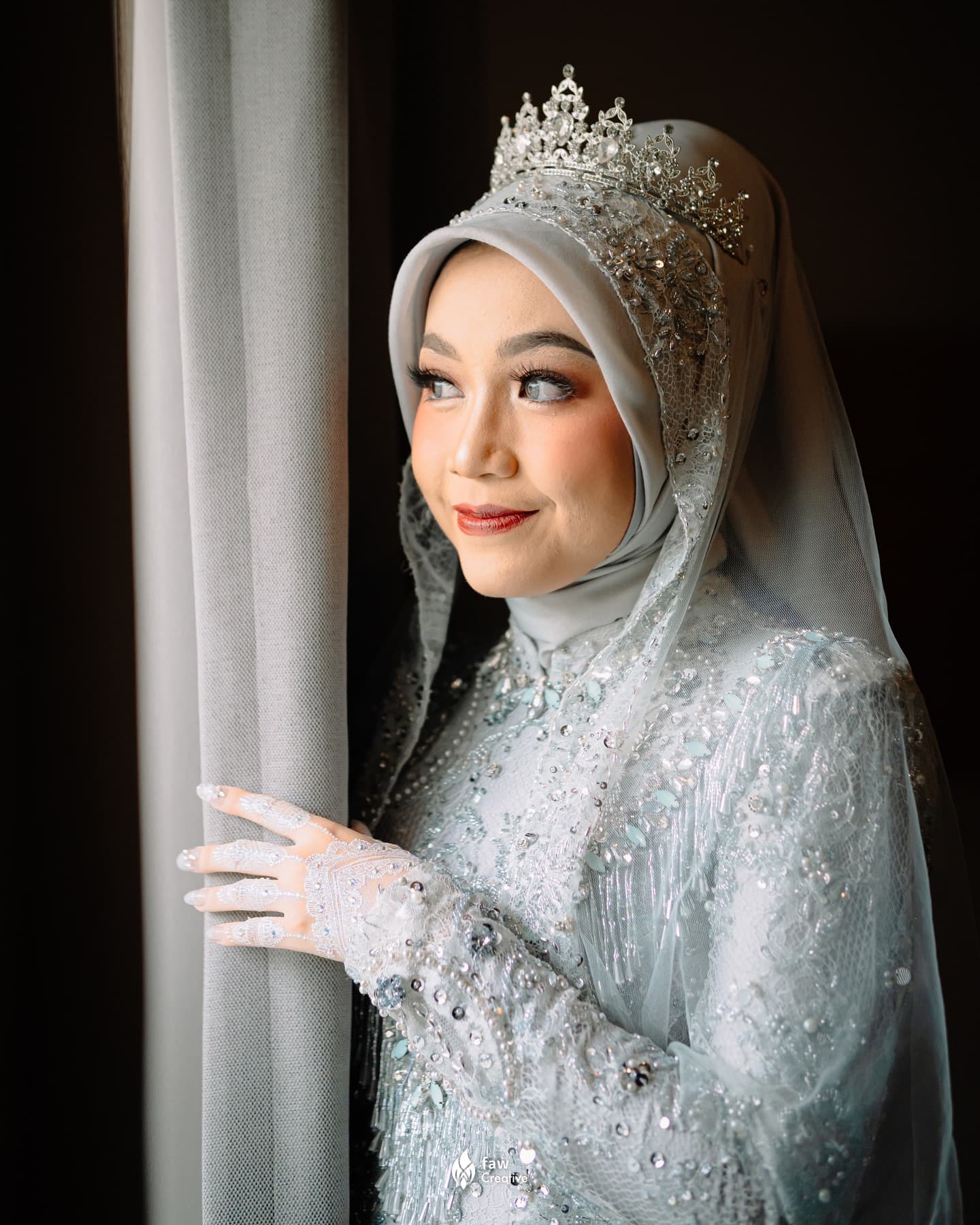 The wedding of Auwfar and Arifah in Jakarta, the couple during the ceremony surrounded by family