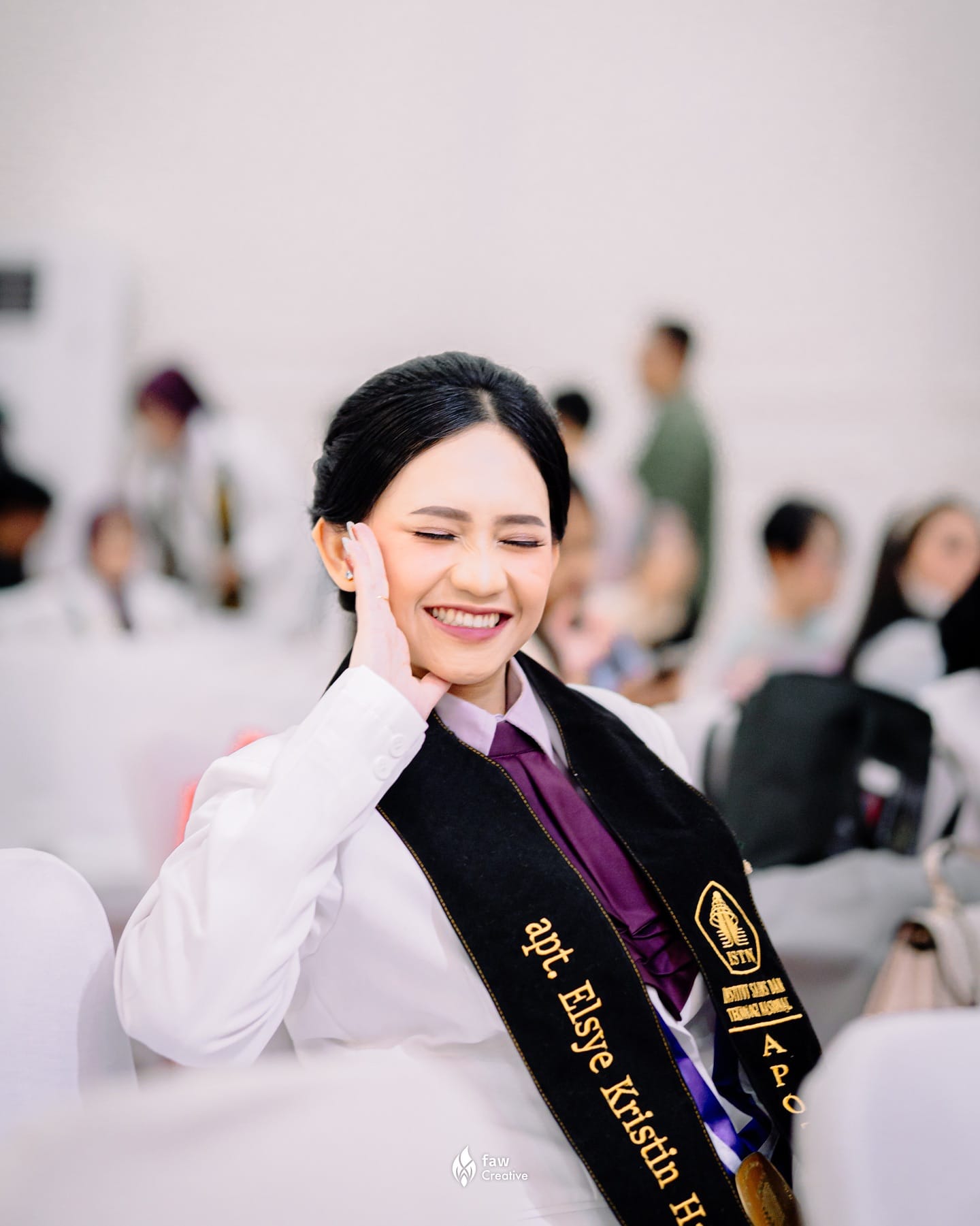Thesis defense portrait: a graduate with her bouquet right after the defense
